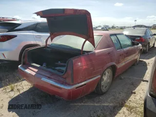 2000 Cadillac Eldorado z VIN 1G6EL12Y7YU198685, wystawiony jako Copart lot #75093094 z przebiegiem Nie podano mil oraz Szkody całkowita. Historia ofert i sprzedaży dostępna na DreamBid. Obrazek 3.