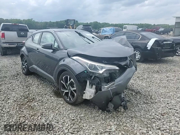 2018 Toyota C-HR XLE z VIN NMTKHMBX7JR004515, wystawiony jako Copart lot #57106385 z przebiegiem Nie podano mil oraz Szkoda całkowita • Salvage title. Historia ofert i sprzedaży dostępna na DreamBid. Obrazek 14.