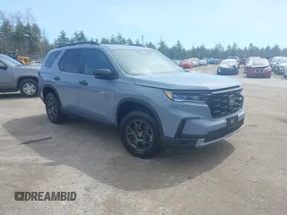2024 Honda Pilot TrailSport z VIN 5FNYG1H63RB010288, wystawiony jako IAAI lot #41778181 z przebiegiem 19 672 mil mil oraz . Historia ofert i sprzedaży dostępna na DreamBid. Obrazek 1.