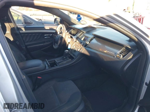 2014 Ford Taurus SEL z VIN 1FAHP2E87EG121069, wystawiony jako IAAI lot #41030422 z przebiegiem 138 043 mil mil oraz . Historia ofert i sprzedaży dostępna na DreamBid. Obrazek 5.