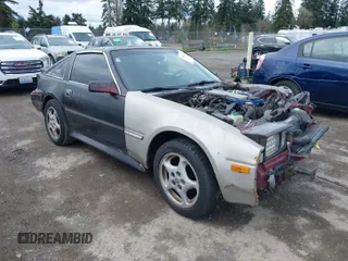 1986 Nissan 300ZX z VIN JN1HZ14S4GX140955, wystawiony jako IAAI lot #41935505 z przebiegiem 144 917 mil mil oraz . Historia ofert i sprzedaży dostępna na DreamBid. Obrazek 1.