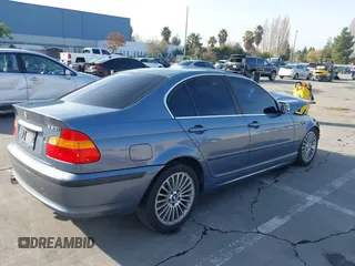 2003 BMW 3 Series 330i with VIN WBAEV53453KM03321, listed as a IAAI auction lot 41134433 with 186,586 mi miles. Bid and sale history available at carsss.com. Image 4.