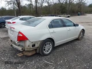 2011 Ford Fusion S with VIN 3FAHP0GA1BR337461, listed as a IAAI auction lot 41715964 with 219,486 mi miles. Bid and sale history available at carsss.com. Image 4.
