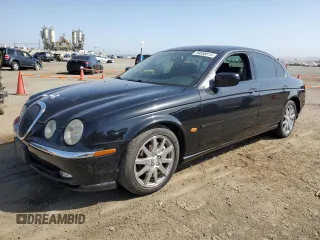 2000 Jaguar S-Type V8 with VIN SAJDA01D3YGL31658, listed as a Copart auction lot 86770924 with 54,210 mi miles and Salvage Title. Bid and sale history available at DreamBid. Image 1.