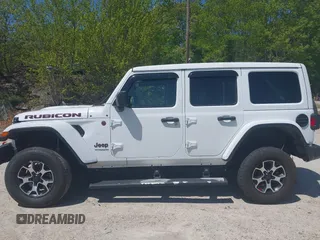 2021 Jeep Wrangler Unlimited Rubicon with VIN 1C4HJXFG5MW586842, listed as a IAAI auction lot 42186683 with 76,450 mi miles and . Bid and sale history available at DreamBid. Image 14.