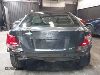 2012 Scion tC with VIN JTKJF5C7XC3034998, listed as a IAAI auction lot 41591632 with 171,121 mi miles. Bid and sale history available at carsss.com. Image 6.