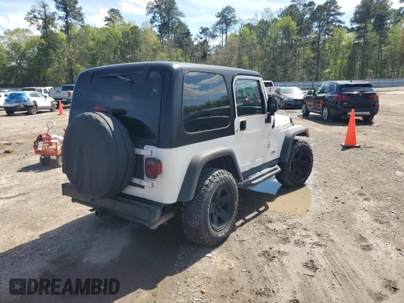 2003 Jeep Wrangler Rubicon z VIN 1J4FA69S73P333199, wystawiony jako Copart lot #50602615 z przebiegiem 133 254 mil mil oraz Szkoda całkowita • Salvage title. Historia ofert i sprzedaży dostępna na DreamBid. Obrazek 3.