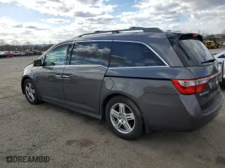 2013 Honda Odyssey Touring with VIN 5FNRL5H96DB010599, listed as a Copart auction lot 52316325 with 179,840 mi miles and Salvage Title. Bid and sale history available at carsss.com. Image 2.