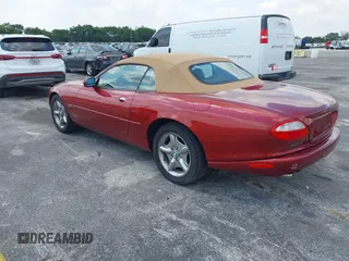 1997 Jaguar XK with VIN SAJGX2743VC017588, listed as a IAAI auction lot 42055716 with 66,052 mi miles and . Bid and sale history available at DreamBid. Image 3.