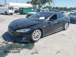 2014 Tesla Model S P85D with VIN 5YJSA1H25EFP65571, listed as a IAAI auction lot 42185442 with 115,990 mi miles and . Bid and sale history available at DreamBid. Image 2.
