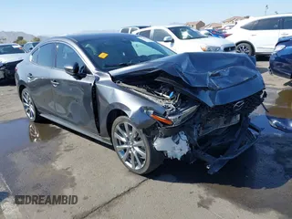 2021 Mazda 3 Premium with VIN JM1BPADL2M1306857, listed as a IAAI auction lot 41719452 with 30,617 mi miles and . Bid and sale history available at DreamBid. Image 1.