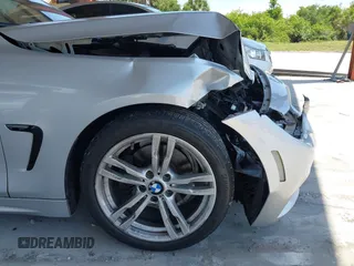 2015 BMW 4 Series 428i with VIN WBA4A5C58FD410076, listed as a IAAI auction lot 39384271 with 125,987 mi miles and . Bid and sale history available at DreamBid. Image 13.