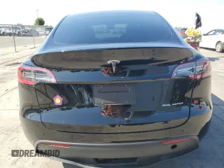 2023 Tesla Model Y Long Range z VIN 7SAYGAEE7PF859030, wystawiony jako Copart lot #58965185 z przebiegiem 18 421 mil mil oraz Czysty tytuł • Clean title. Historia ofert i sprzedaży dostępna na DreamBid. Obrazek 6.