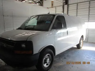 2015 Chevrolet Express Cargo Van with VIN 1GCWGFCF8F1154628, listed as a IAAI auction lot 42088327 with 133,764 mi miles. Bid and sale history available at carsss.com. Image 1.