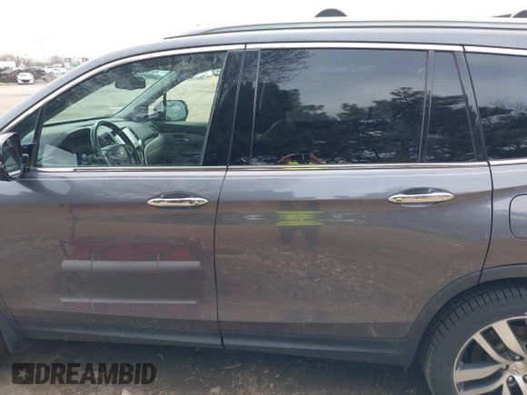 2017 Honda Pilot Touring with VIN 5FNYF6H92HB012090, listed as a IAAI auction lot 41882542 with 110,179 mi miles and . Bid and sale history available at DreamBid. Image 14.