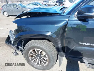 2021 Toyota Tacoma 4WD SR5 with VIN 3TMDZ5BN4MM117564, listed as a IAAI auction lot 41629220 with 77,063 mi miles. Bid and sale history available at carsss.com. Image 6.