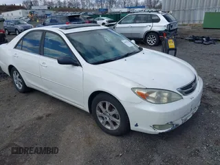2004 Toyota Camry LE z VIN JTDBE32K140249889, wystawiony jako IAAI lot #41983530 z przebiegiem 404 757 mil mil oraz . Historia ofert i sprzedaży dostępna na DreamBid. Obrazek 1.