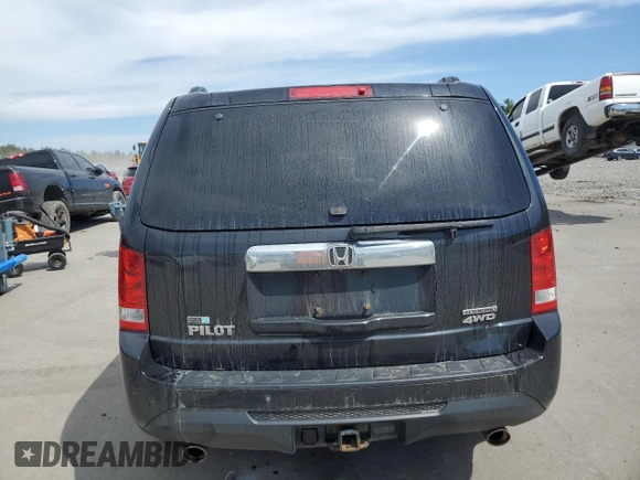 2013 Honda Pilot Touring z VIN 5FNYF4H97DB007336, wystawiony jako Copart lot #52785595 z przebiegiem 141 104 mil mil oraz Szkoda całkowita • Salvage title. Historia ofert i sprzedaży dostępna na DreamBid. Obrazek 6.
