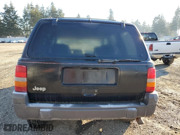 1998 Jeep Grand Cherokee Laredo with VIN 1J4GZ58S0WC106148, listed as a Copart auction lot 42855105 with 263,785 mi miles and Salvage Title. Bid and sale history available at carsss.com. Image 6.