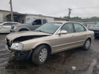 2006 Kia Optima LX z VIN KNAGD126065465879, wystawiony jako Copart lot #59270285 z przebiegiem 139 174 mil mil oraz Szkoda całkowita • Salvage title. Historia ofert i sprzedaży dostępna na DreamBid. Obrazek 1.