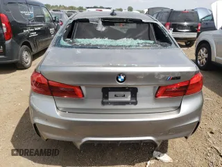2018 BMW M5 z VIN WBSJF0C50JB283220, wystawiony jako Copart lot #62178853 z przebiegiem Nie podano mil oraz . Historia ofert i sprzedaży dostępna na DreamBid. Obrazek 6.