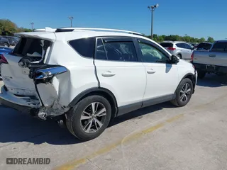2016 Toyota RAV4 XLE with VIN JTMWFREV3GJ082487, listed as a IAAI auction lot 41833158 with 107,332 mi miles. Bid and sale history available at carsss.com. Image 4.