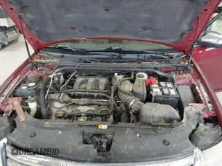 2008 Ford Taurus Limited with VIN 1FAHP28W28G153930, listed as a IAAI auction lot 42154827 with 243,386 mi miles. Bid and sale history available at carsss.com. Image 10.