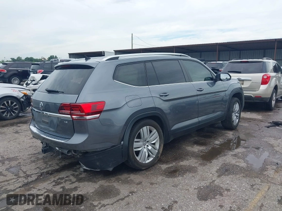 2019 Volkswagen Atlas SE with VIN 1V2WR2CA5KC514748, listed as a IAAI auction lot 42367164 with 57,827 mi miles and . Bid and sale history available at DreamBid. Image 4.
