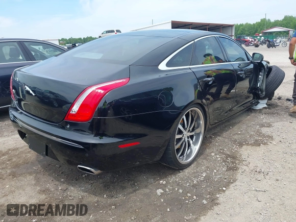 2011 Jaguar XJ with VIN SAJWA1CB3BLV07259, listed as a IAAI auction lot 42108497 with 90,498 mi miles and . Bid and sale history available at DreamBid. Image 4.