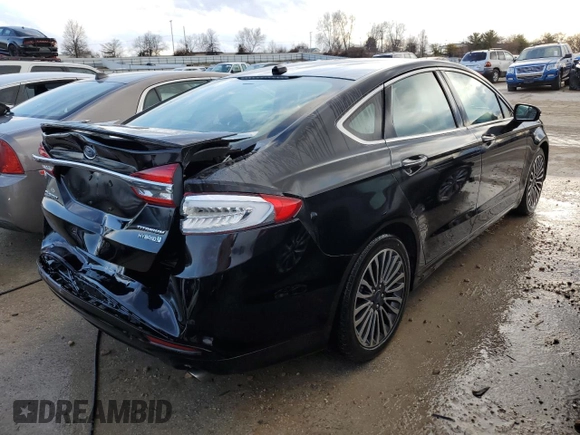 2018 Ford Fusion Titanium with VIN 3FA6P0RU5JR120394, listed as a Copart auction lot 73557602 with 148,870 mi miles and . Bid and sale history available at DreamBid. Image 3.