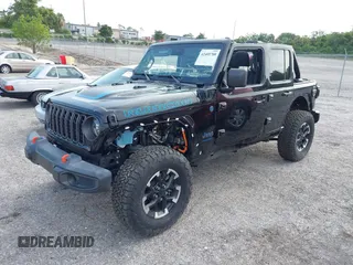 2024 Jeep Wrangler Rubicon X z VIN 1C4RJXR64RW197186, wystawiony jako IAAI lot #42405700 z przebiegiem 6 397 mil mil oraz . Historia ofert i sprzedaży dostępna na DreamBid. Obrazek 2.