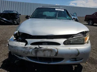 1998 Ford Escort SE with VIN 3FAFP15P4WR240362, listed as a Copart auction lot 63453095 with 220,855 mi miles and Salvage title. Bid and sale history available at DreamBid. Image 5.
