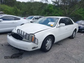 2004 Cadillac DeVille z VIN 1G6KD54YX4U181779, wystawiony jako IAAI lot #41951837 z przebiegiem Nie podano mil oraz . Historia ofert i sprzedaży dostępna na DreamBid. Obrazek 2.