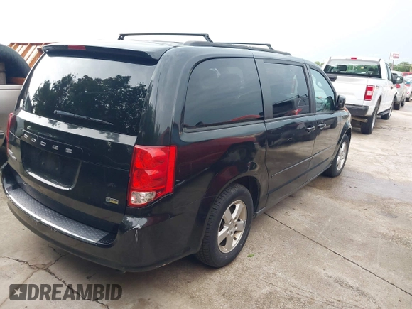 2013 Dodge Grand Caravan SXT with VIN 2C4RDGCG0DR552784, listed as a IAAI auction lot 42116395 with 96,917 mi miles and . Bid and sale history available at DreamBid. Image 4.
