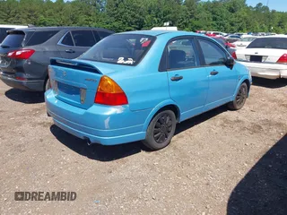 2005 Suzuki Aerio S z VIN JS2RA62SX55256992, wystawiony jako IAAI lot #42294720 z przebiegiem 141 626 mil mil oraz . Historia ofert i sprzedaży dostępna na DreamBid. Obrazek 4.