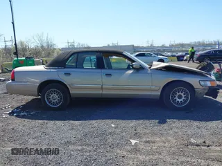 1998 Mercury Grand Marquis GS z VIN 2MEFM74W3WX668888, wystawiony jako IAAI lot #42042350 z przebiegiem 113 702 mil mil oraz . Historia ofert i sprzedaży dostępna na DreamBid. Obrazek 14.