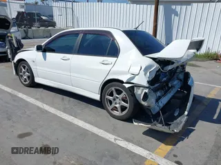 2005 Mitsubishi Lancer Evolution VIII with VIN JA3AH86DX5U054278, listed as a IAAI auction lot 41881180 with 157,497 mi miles. Bid and sale history available at carsss.com. Image 3.