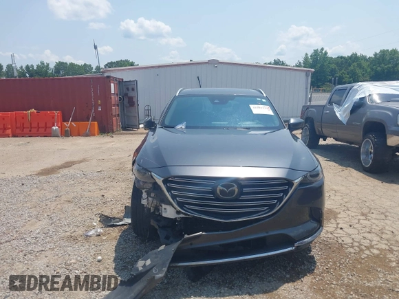 2018 Mazda CX-9 Grand Touring with VIN JM3TCADY7J0217595, listed as a IAAI auction lot 42381331 with 130,604 mi miles and . Bid and sale history available at DreamBid. Image 12.