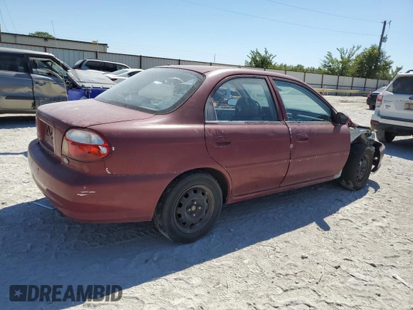 2001 Kia Sephia z VIN KNAFB121115074609, wystawiony jako Copart lot #72346144 z przebiegiem 88 400 mil mil oraz Czysty tytuł • Clean title. Historia ofert i sprzedaży dostępna na DreamBid. Obrazek 3.