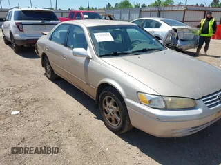 1999 Toyota Camry LE z VIN JT2BF22K6X0216844, wystawiony jako IAAI lot #41979239 z przebiegiem 291 418 mil mil oraz . Historia ofert i sprzedaży dostępna na DreamBid. Obrazek 1.