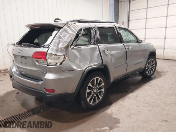 2018 Jeep Grand Cherokee Limited z VIN 1C4RJFBG1JC204615, wystawiony jako IAAI lot #42389992 z przebiegiem 98 335 mil mil oraz . Historia ofert i sprzedaży dostępna na DreamBid. Obrazek 4.