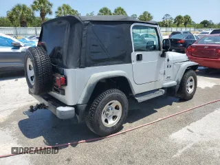 2004 Jeep Wrangler X with VIN 1J4FA39S74P763492, listed as a Copart auction lot 54664095 with 168,493 mi miles and Salvage Title. Bid and sale history available at DreamBid. Image 3.
