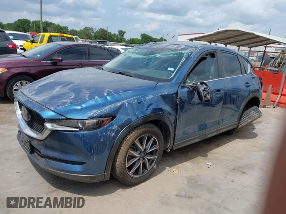2018 Mazda CX-5 Touring z VIN JM3KFACM5J1442416, wystawiony jako IAAI lot #42093137 z przebiegiem 65 102 mil mil oraz . Historia ofert i sprzedaży dostępna na DreamBid. Obrazek 18.