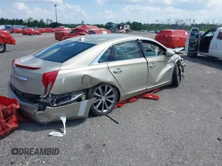 2014 Cadillac XTS z VIN 2G61L5S39E9159583, wystawiony jako IAAI lot #36024597 z przebiegiem 118 461 mil mil oraz . Historia ofert i sprzedaży dostępna na DreamBid. Obrazek 4.