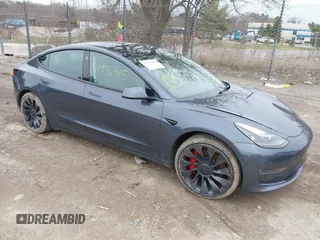 2023 Tesla Model 3 Performance with VIN 5YJ3E1EC9PF407365, listed as a IAAI auction lot 41956915 with 31,087 mi miles. Bid and sale history available at carsss.com. Image 1.