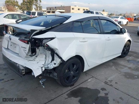 2021 Toyota Prius L Eco with VIN JTDKAMFU9M3131228, listed as a IAAI auction lot 41257117 with 72,840 mi miles. Bid and sale history available at carsss.com. Image 4.