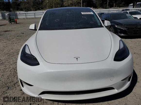 2023 Tesla Model Y Long Range z VIN 7SAYGDEE7PF788932, wystawiony jako Copart lot #52822515 z przebiegiem 33 007 mil mil oraz Szkoda całkowita • Salvage title. Historia ofert i sprzedaży dostępna na DreamBid. Obrazek 5.
