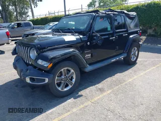 2018 Jeep Wrangler Unlimited Sahara with VIN 1C4HJXEN7JW328981, listed as a IAAI auction lot 42217508 with 59,584 mi miles and . Bid and sale history available at DreamBid. Image 2.