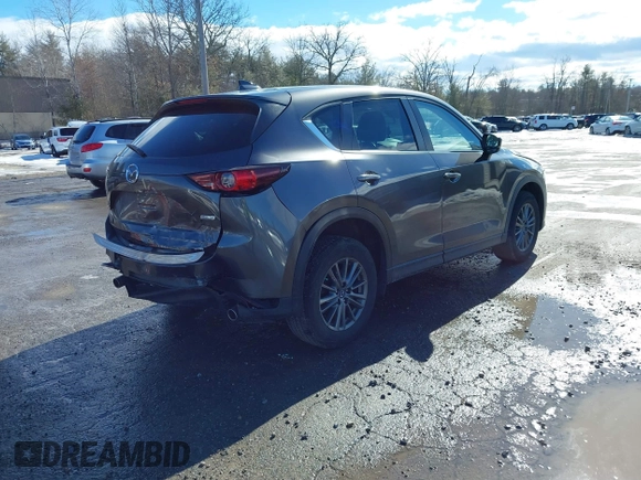 2017 Mazda CX-5 Touring with VIN JM3KFBCL3H0214881, listed as a IAAI auction lot 41694560 with 64,609 mi miles. Bid and sale history available at carsss.com. Image 4.