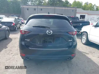 2018 Mazda CX-5 Touring z VIN JM3KFBCM9J0358997, wystawiony jako IAAI lot #42332606 z przebiegiem 93 952 mil mil oraz . Historia ofert i sprzedaży dostępna na DreamBid. Obrazek 16.